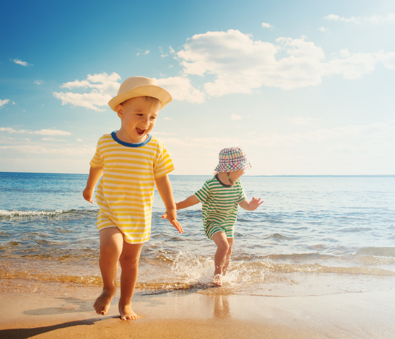 Two kids playing on the beach